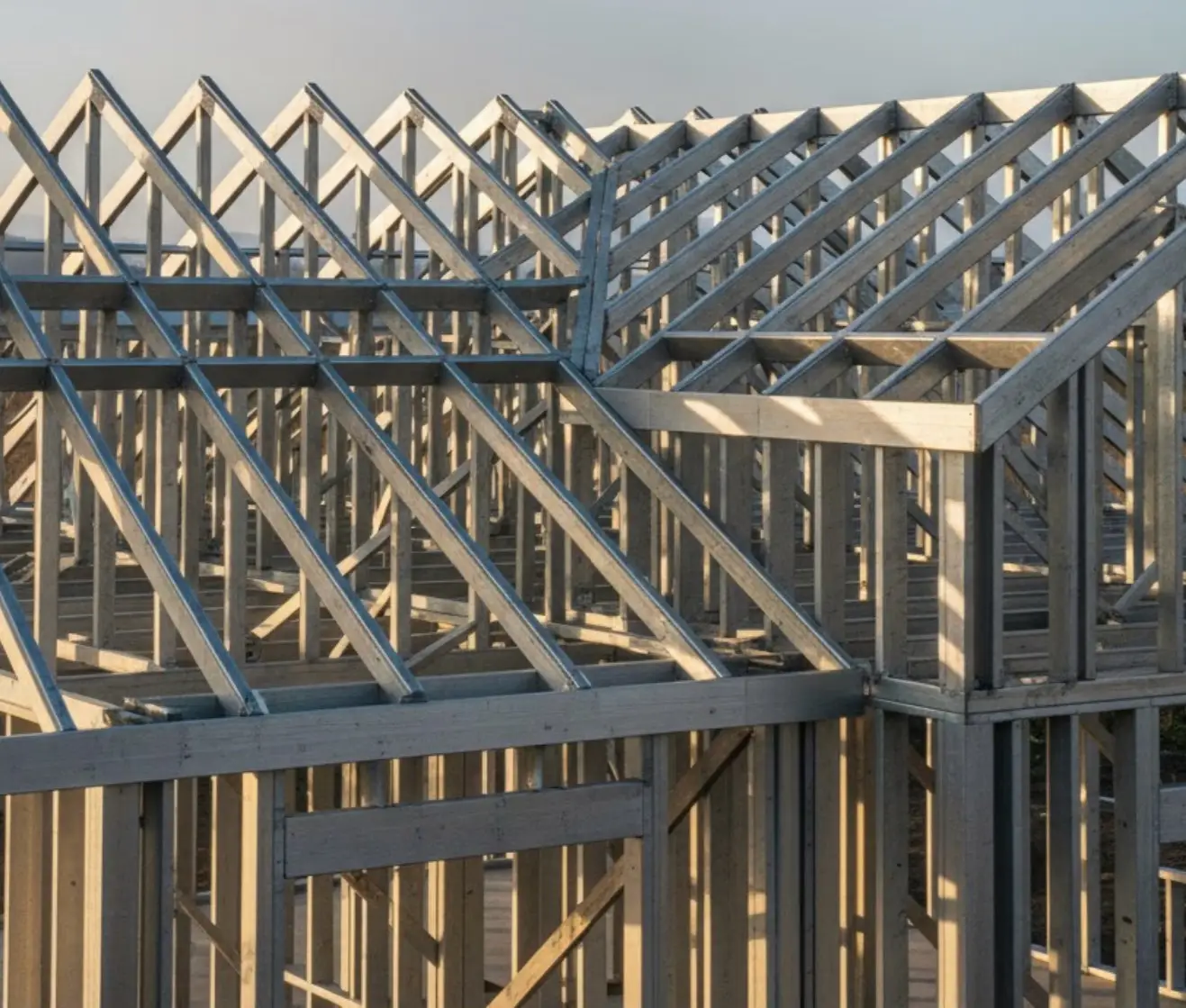 Factory-assembled steel wall framing and trusses